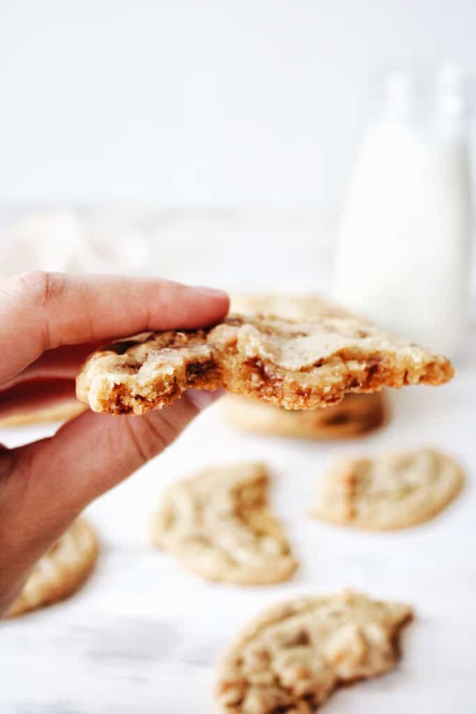 hand holding half eaten cookie showing the texture