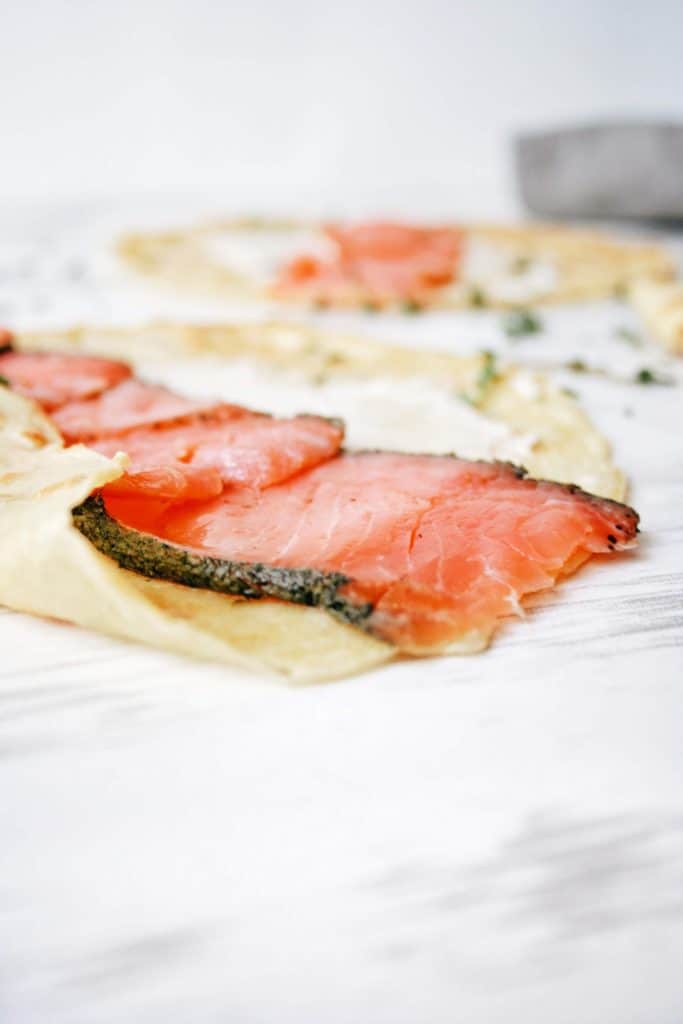 close up of smoked salmon in a crepe with cream cheese