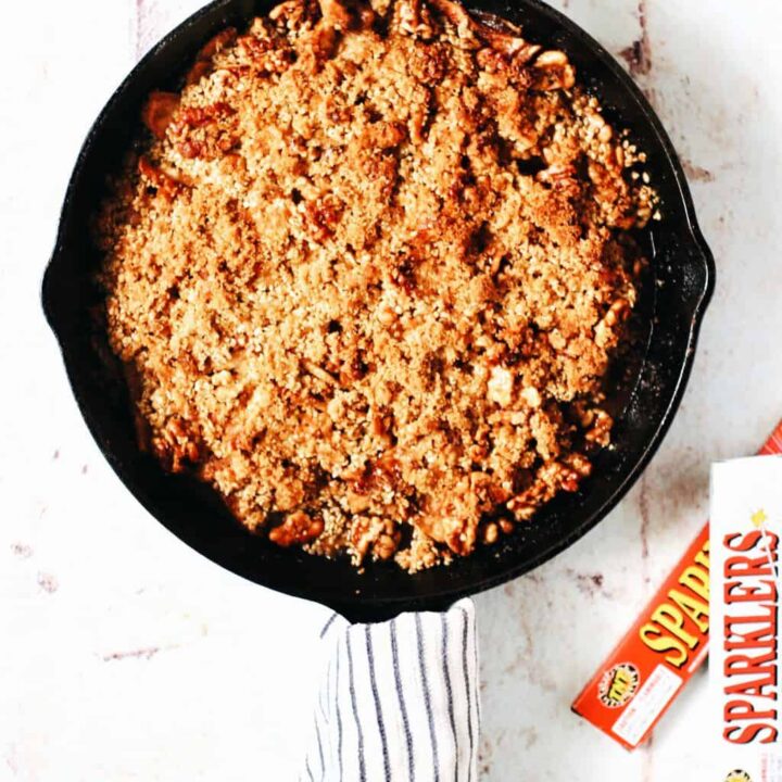 cast iron skillet full of apple crumble