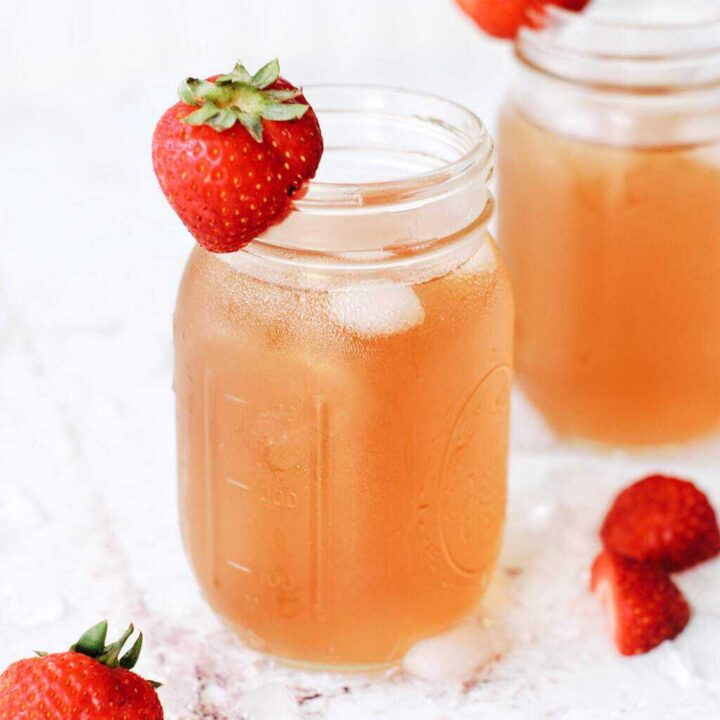 sweet green iced tea with strawberries and crushed ice