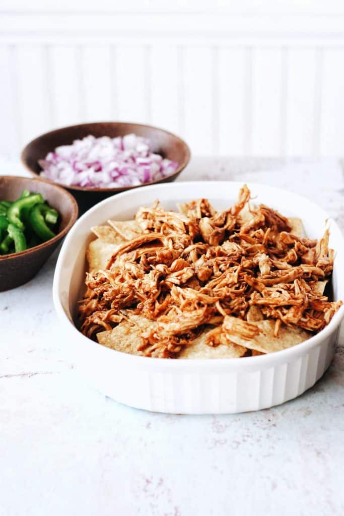 nacho chips with bbq pulled chicken on top