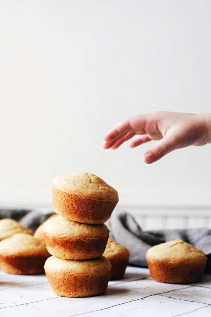 hand reaching for a muffin