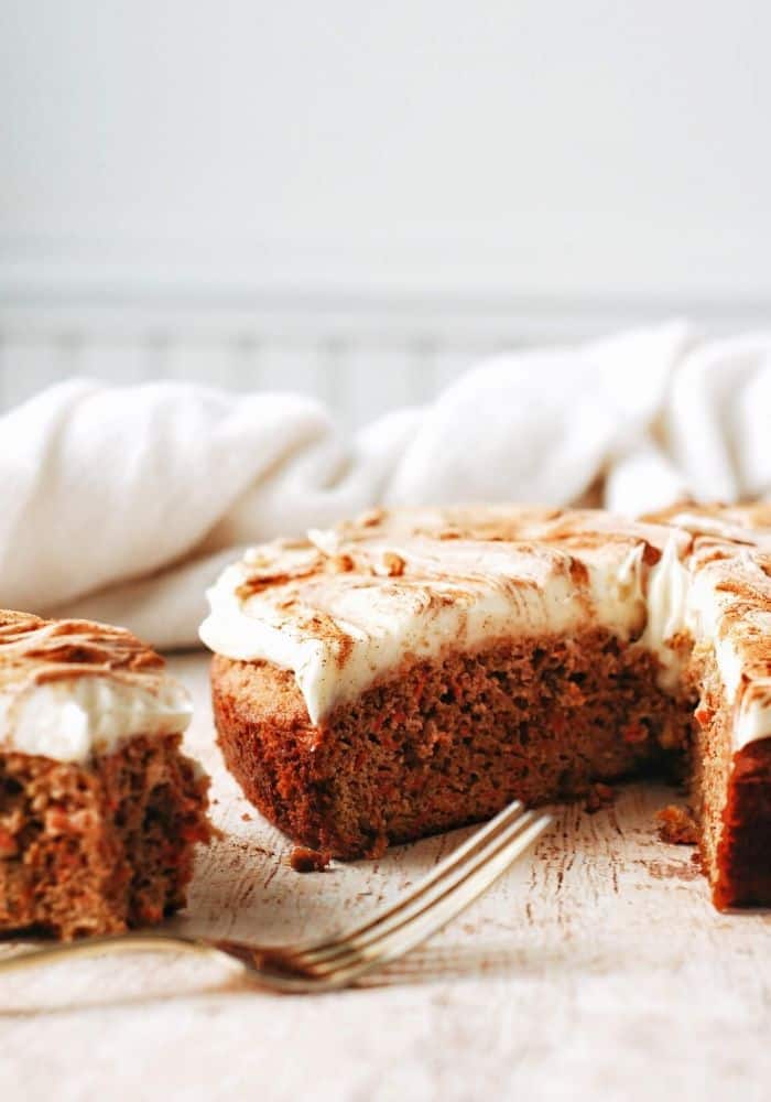fluffy almond flour carrot cake with cream cheese frosting and cinnamon