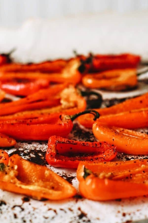 a bunch of roasted peppers laid out