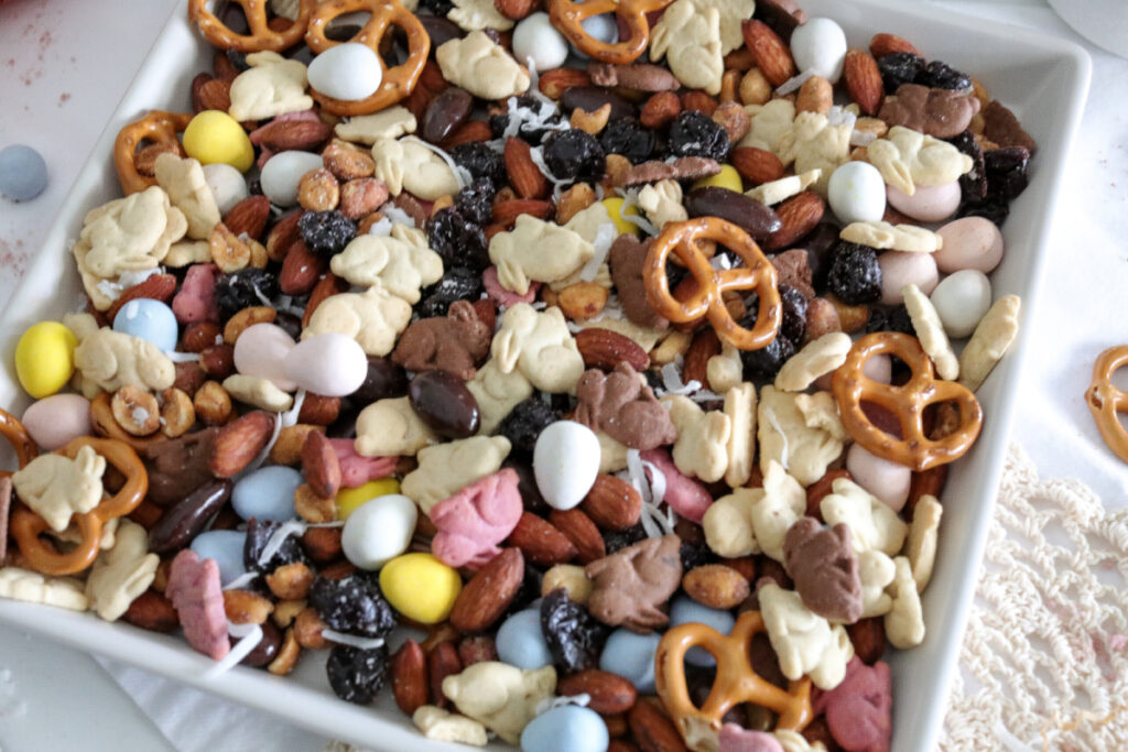 close up above photo of easter trail mix in a white square bowl