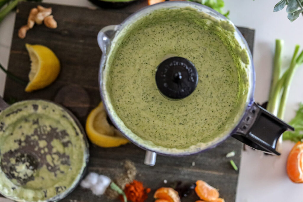 horizonal above photo of green goddess dressing in a food processor